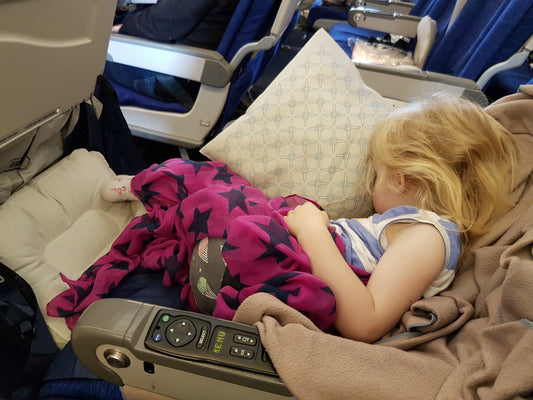 9 Tips to Get Your Child to Sleep on a Plane
